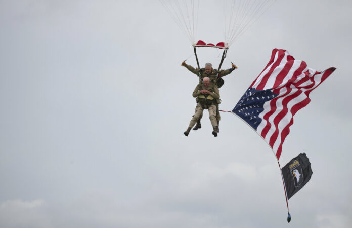 U.S. World War II D-Day veteran Tom Rice, from Coronado, CA, parachutes in a tandem jump into a field in Carentan, Normandy, France, Wednesday, June 5, 2019. Approximately 200 parachutists participated in the jump over Normandy on Wednesday, replicating a jump made by U.S. soldiers on June 6, 1944 as a prelude to the seaborne invasions on D-Day. Photo: AP