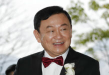 Thailand’s Divisive Ex-prime Minister Thaksin Shinawatra Readies Return During Political Turmoil FILE - In this Friday, March 22, 2019 file photo, Former Thai Prime Minister Thaksin Shinawatra welcomes his guests for the wedding of his youngest daughter Paetongtarn "Ing" Shinawatra at a hotel in Hong Kong. A court in Thailand has on Thursday, June 6, 2019 sentenced former Prime Minister Thaksin Shinawatra in absentia to two years in prison over his handling of a state lottery program he initiated while in office more than a decade ago. Photo: Kin Cheung / AP