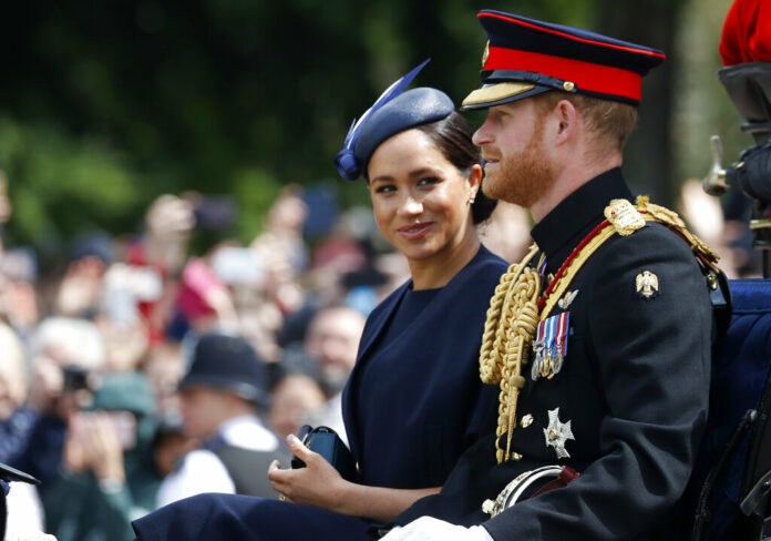 FILE - In this Saturday, June 8, 2019 file photo, Britain's Meghan, the Duchess of Sussex and Prince Harry ride in a carriage to attend the annual Trooping the Colour Ceremony in London. Kensington Palace says on Thursday, June 20 the Duke and Duchess of Sussex will be starting their own foundation to support their charitable endeavors, formally spinning off from the entity Prince Harry and Prince William established together a decade ago. Photo: Frank Augstein / AP File