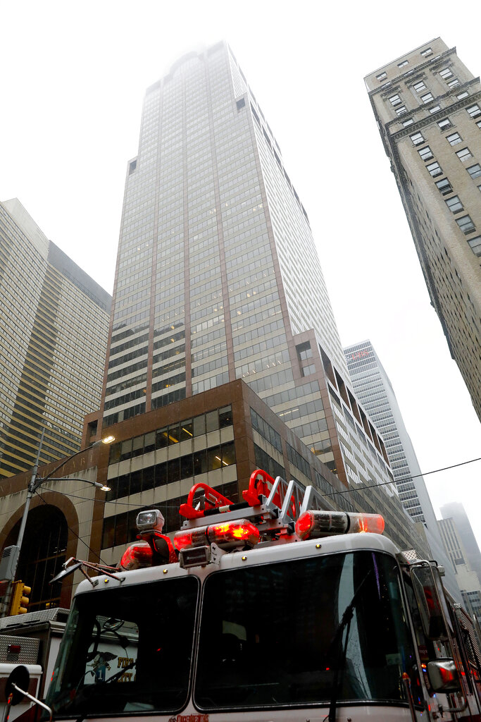New York firefighters respond to the scene where a helicopter was reported to have crash landed on top of a building in midtown Manhattan, Monday, June 10, 2019, in New York.  Photo: Mark Lennihan / AP