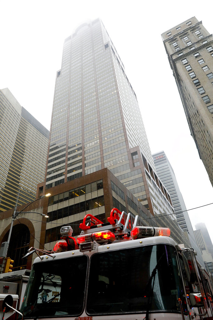 New York firefighters respond to the scene where a helicopter was reported to have crash landed on top of a building in midtown Manhattan, Monday, June 10, 2019, in New York. Photo: Mark Lennihan / AP