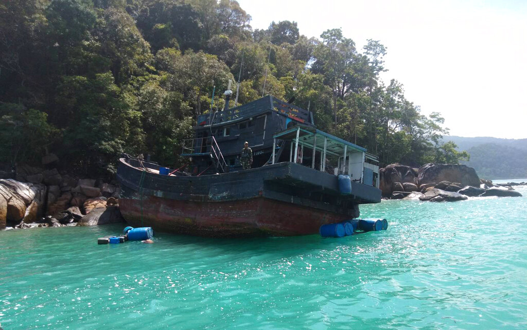 Thai navy search a shipwrecked boat at Rawi island in Satun province Southern of Thailand Tuesday, June 11, 2019.  Thai officials say they have discovered 65 ethnic Rohingya Muslim refugees who were shipwrecked and stranded in southern Thailand. Photo: Department of National Parks Wildlife and Plant Conservation via AP