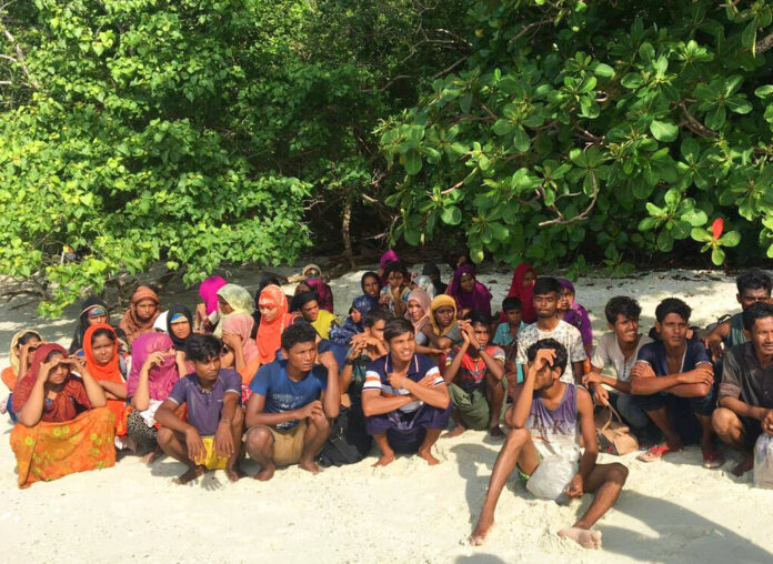 Rohingya sits on a beach at Rawi island in Satun province Southern of Thailand Tuesday, June 11, 2019. Thai officials say they have discovered 65 ethnic Rohingya Muslim refugees who were shipwrecked and stranded in southern Thailand. Photo: Department of National Parks Wildlife and Plant Conservation via AP