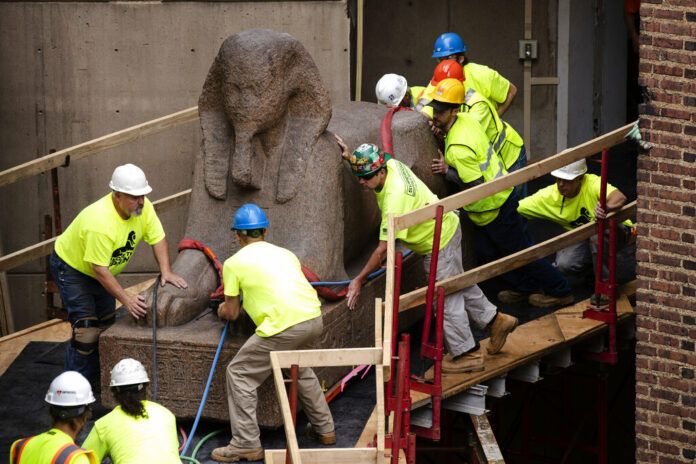 Workers move a 25,000-pound Sphinx of Ramses II at the Penn Museum in Philadelphia, Wednesday, June 12, 2019. The 3,000-year-old sphinx is being relocated from the Egypt Gallery where it's resided since 1926 to a featured location in the museum's new entrance hall. Photo: Matt Rourke / AP