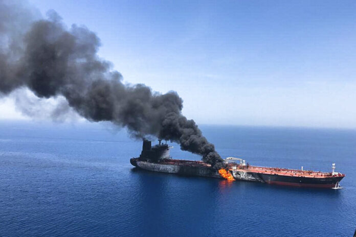 An oil tanker is on fire in the sea of Oman, Thursday, June 13, 2019. Two oil tankers near the strategic Strait of Hormuz were reportedly attacked on Thursday, an assault that left one ablaze and adrift as sailors were evacuated from both vessels and the U.S. Navy rushed to assist amid heightened tensions between Washington and Tehran. Photo: ISNA / AP