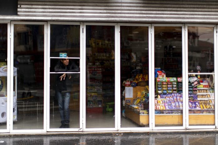 A man stands inside a store without power during a blackout, in Buenos Aires, Argentina, Sunday, June 16, 2019. Argentina and Uruguay were working frantically to return power on Sunday, after a massive power failure left large swaths of the South American countries in the dark. Photo: Tomas F. Cuesta / AP