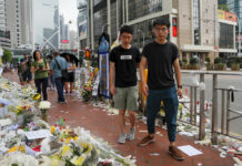 Hong Kong Activist Joshua Wong Released From Prison Pro-democracy activist Joshua Wong, right, is accompanied by Nathan Law as they pay respect to a protester who fell to his death after hanging a protest banner against an extradition bill in Hong Kong, Monday, June 17, 2019. Photo: Kin Cheung / AP