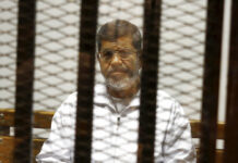 Egypt’s Ousted President Morsi Dies in Court During Trial FILE - In this May 8, 2014 file photo, Egypt's ousted Islamist President Mohammed Morsi sits in a defendant cage in the Police Academy courthouse in Cairo, Egypt. On Monday June 17, 2019, Egypt's state TV said the country's ousted President Mohammed Morsi, 67, collapsed during a court session and died. It said it occurred while he was attending a court trial on espionage charges. Morsi, who hailed from Egypt's largest Islamist group, the now outlawed Muslim Brotherhood, was elected president in 2012 in the country's first free elections following the ouster the year before of longtime leader Hosni Mubarak. Photo: Tarek el-Gabbas / AP