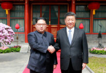 China’s Xi Arrives in North Korea for Talks With Kim Jong Un FILE - In this March 27, 2018, file photo, North Korean leader Kim Jong Un, left, shakes hands with Chinese counterpart Xi Jinping at Diaoyutai State Guesthouse in Beijing, China. Kim’s fifth meeting with Xi continues his ambitious diplomatic outreach that has included summits with the leaders of the United States, South Korea and Russia in the past year and a half. Experts say Kim is attempting to form a united front with North Korea’s main ally China to strengthen his leverage in the stalled nuclear negotiations with the United States. Photo: Korean Central News Agency/Korea News Service via AP, File