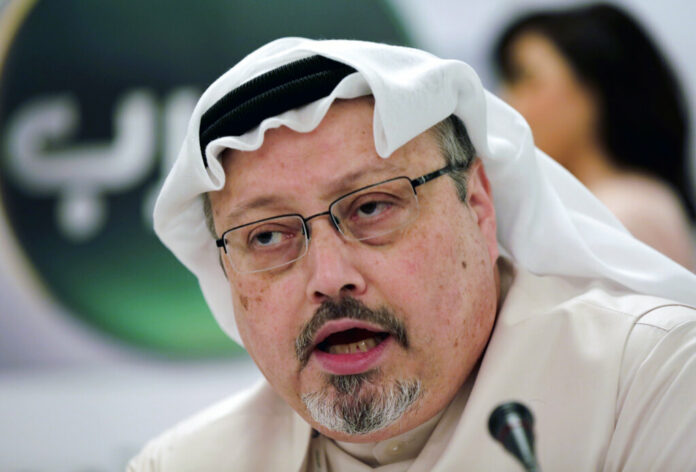 FILE - In this Dec. 15, 2014 file photo, Saudi journalist Jamal Khashoggi speaks during a press conference in Manama, Bahrain. An independent U.N. human rights expert investigating the killing of Saudi journalist Jamal Khashoggi is recommending an investigation into the possible role of Saudi Crown Prince Mohammed bin Salman, citing 