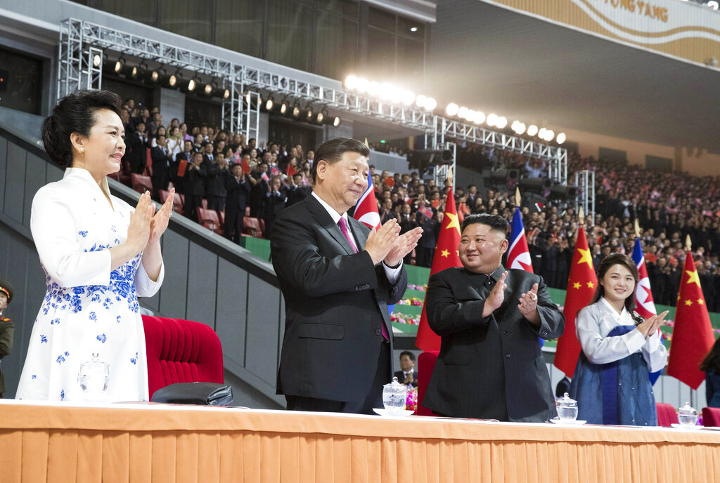 In this Thursday, June 20, 2019, photo released by China's Xinhua News Agency, visiting Chinese President Xi Jinping, second from left, and his wife Peng Liyuan, left, and North Korean leader Kim Jong Un, second from right, and his wife Ri Sol Ju, right, applaud during a mass gymnastic performance at the May Day Stadium in Pyongyang, North Korea. North Korean leader Kim Jong Un, meeting in Pyongyang with Chinese President Xi Jinping, said Thursday that his country is waiting for a desired response in stalled nuclear talks with the United States. Photo: Huang Jingwen/Xinhua via AP