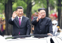 North Says Kim, China’s Xi Discussed Korean Peninsula Issues In this Thursday, June 20, 2019, photo released by China's Xinhua News Agency, visiting Chinese President Xi Jinping, left, and North Korean leader Kim Jong Un wave from an open top limousine as they travel along a street in Pyongyang, North Korea. North Korean leader Kim Jong Un, meeting in Pyongyang with Chinese President Xi Jinping, said Thursday that his country is waiting for a desired response in stalled nuclear talks with the United States. Photo: Ju Peng/Xinhua via AP