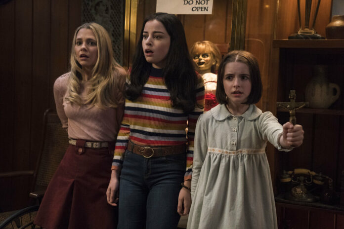 This image released by Warner Bros. Pictures shows Madison Iseman, from left, Katie Sarife and McKenna Grace in a scene from the horror film, This image released by Warner Bros. Pictures shows Madison Iseman, from left, Katie Sarife and McKenna Grace in a scene from the horror film,