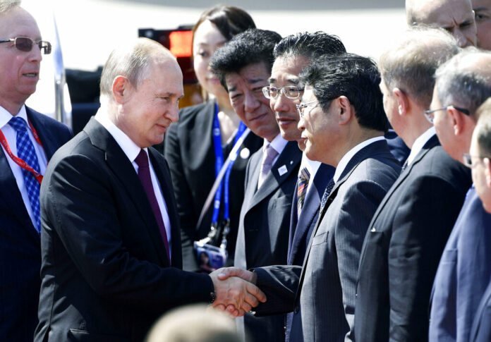 Russian President Vladimir Putin are greeted on his arrival at Kansai International Airport in Izumisano, Osaka prefecture, Friday, June 28, 2019. Group of 20 leaders gather in Osaka on June 28 and 29 for their annual summit. Photo: Junko Ozaki / Kyodo News via AP
