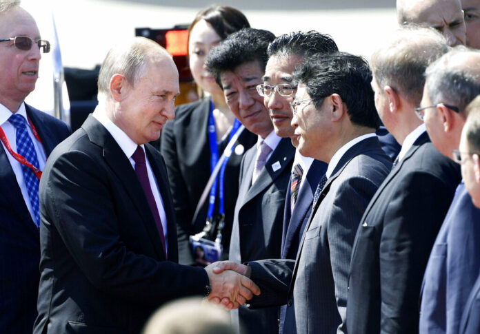 Russian President Vladimir Putin are greeted on his arrival at Kansai International Airport in Izumisano, Osaka prefecture, Friday, June 28, 2019. Group of 20 leaders gather in Osaka on June 28 and 29 for their annual summit. Photo: Junko Ozaki / Kyodo News via AP Russian President Vladimir Putin are greeted on his arrival at Kansai International Airport in Izumisano, Osaka prefecture, Friday, June 28, 2019. Group of 20 leaders gather in Osaka on June 28 and 29 for their annual summit. Photo: Junko Ozaki / Kyodo News via AP