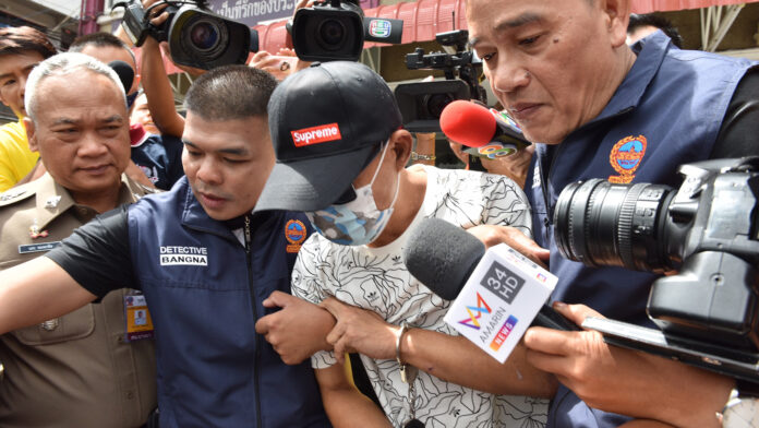 Pramuk Wichiandilokkun being escorted to Bangna Police Station on June 20. Pramuk Wichiandilokkun being escorted to Bangna Police Station on June 20.