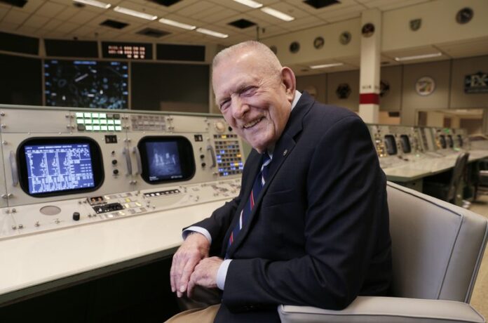 Gene Kranz, aerospace engineer, fighter pilot, an Apollo-era flight director and later director of NASA flight operations, sits at the console where he worked during the Gemini and Apollo missions at the NASA Johnson Space Center Monday, June 17, 2019, in Houston.