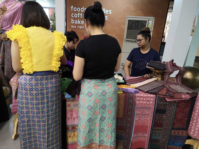 Participants wear traditional Thai clothes at a panel discussion on June 20, 2019.