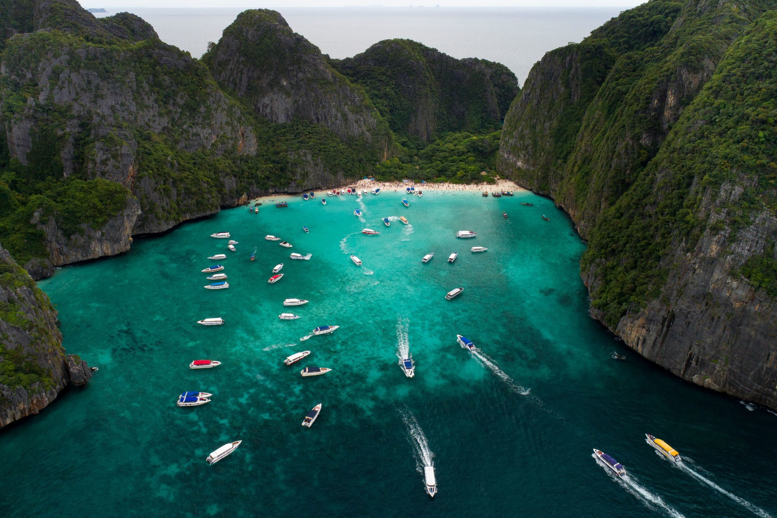 Tourist boats milling around Maya Bay before its closure in 2018. Photo: Sirachai Arunrugstichai / Courtesy