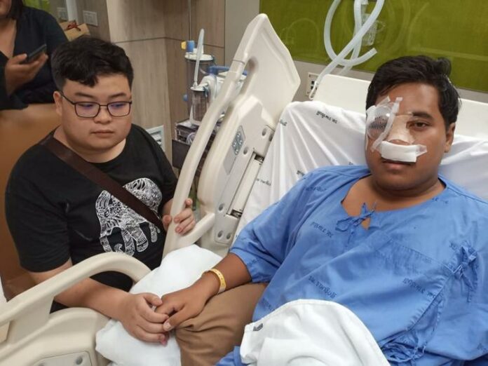 Student activist Parit Chiwarak, left, visits his friend Sirawith Seritiwat in hospital on July 2, 2019. Image: Sa-nguan Khumrungroj / Facebook