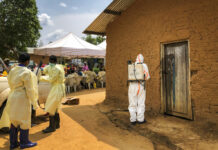Congo Confirms 1st Ebola Case in City of Goma A worker from the World Health Organization (WHO) decontaminates the doorway of a house on a plot where two cases of Ebola were found, in the village of Mabalako, in eastern Congo Monday, June 17, 2019. Health officials in eastern Congo have begun offering vaccinations to all residents in the hotspot of Mabalako whereas previous efforts had only targeted known contacts or those considered to be at high risk. Photo: Al-hadji Kudra Maliro / AP