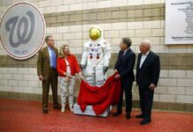 Don’t Recall Apollo 11? Global Festivities Have You Covered In this June 4, 2019 file photo, Washington Nationals senior vice president Gregory McCarthy, from left, Ellen Stofan of the National Air and Space Museum, statue donor Allan Holt and Nationals owner Mark Lerner unveil a statue of Neil Armstrong's Apollo 11 spacesuit before an interleague baseball game between the Chicago White Sox and the Nationals in Washington. It was unveiled as part of the "Apollo at the Park" program, which will place statues of Armstrong's spacesuit at ballparks across the country to commemorate the moon landing's 50th anniversary. Photo: Patrick Semansky / AP