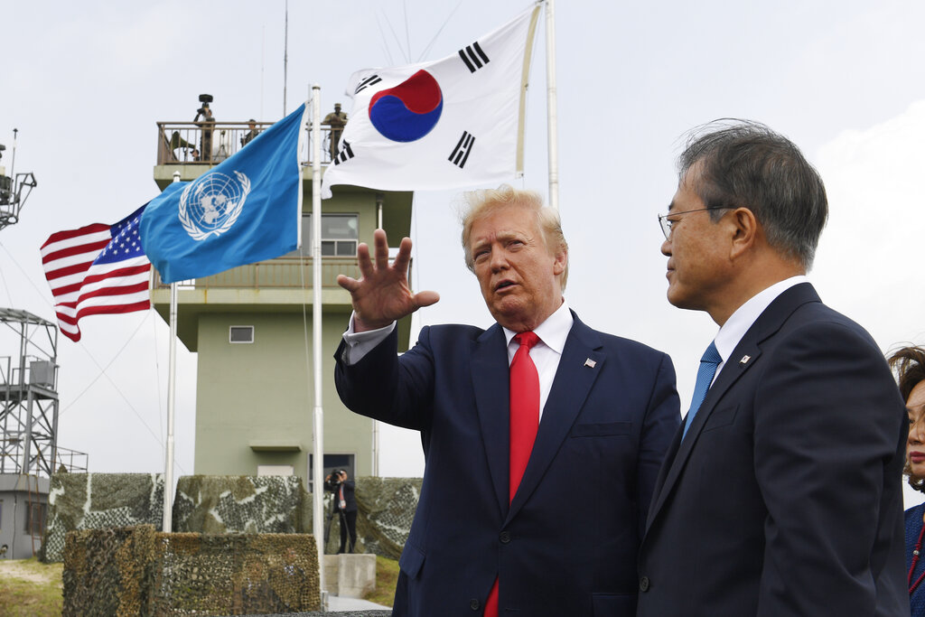 President Donald Trump talks with South Korean President Moon Jae-in and views North Korea from the Korean Demilitarized Zone from Observation Post Ouellette at Camp Bonifas in South Korea, Sunday, June 30, 2019. Photo: Susan Walsh / AP
