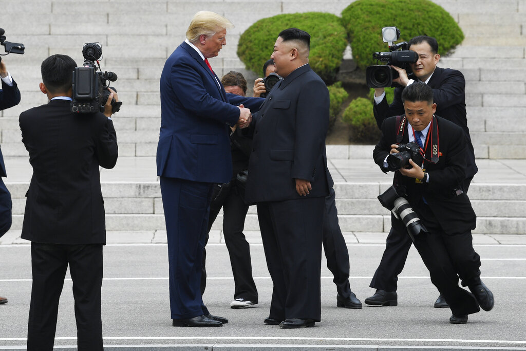 President Donald Trump walks to the North Korean side of the border with North Korean leader Kim Jong Un at the border village of Panmunjom in the Demilitarized Zone, South Korea, Sunday, June 30, 2019. Photo: Susan Walsh / AP