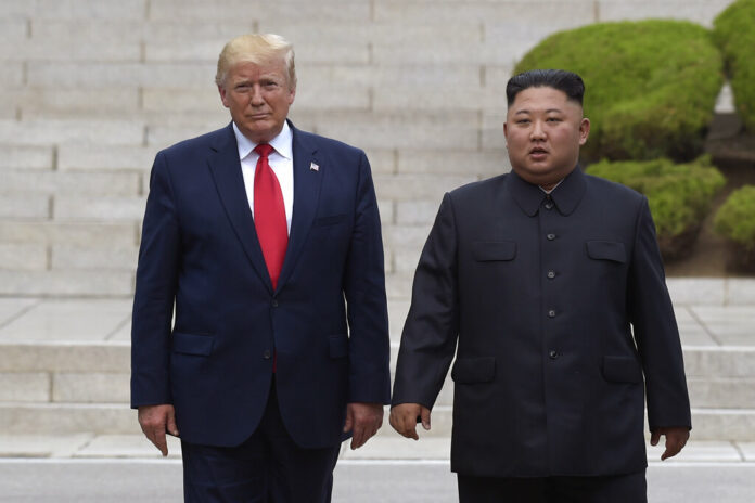 President Donald Trump, left, meets with North Korean leader Kim Jong Un at the North Korean side of the border at the village of Panmunjom in Demilitarized Zone, Sunday, June 30, 2019. Photo: Susan Walsh / AP