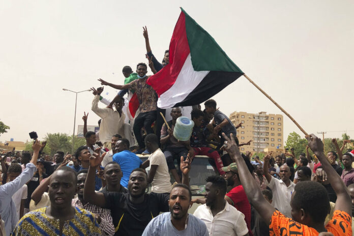 Sudanese shout slogans during a demonstration against the military council, in Khartoum, Sudan, Sunday, June 30, 2019. Tens of thousands of protesters have taken to the streets in Sudan's capital and elsewhere in the country calling for civilian rule nearly three months after the army forced out long-ruling autocrat Omar al-Bashir. The demonstrations came amid a weekslong standoff between the ruling military council and protest leaders. Photo: Hussein Malla / AP