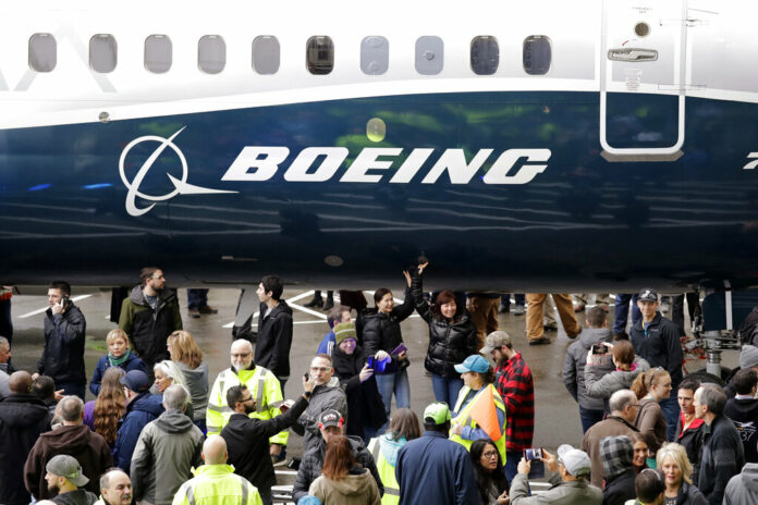 FILE - In this Feb. 5, 2018, file photo a Boeing 737 MAX 7, the newest version of Boeing's fastest-selling airplane, is displayed during a debut for employees and media of the new jet in Renton, Wash. Boeing says it's providing $100 million over several years to help families and communities affected by two crashes of its 737 Max plane that killed 346 people. The company said Wednesday, July 3, 2019, that some of the money will go toward living expenses and to cover hardship suffered by the families of dead passengers. Photo: Elaine Thompson / AP File