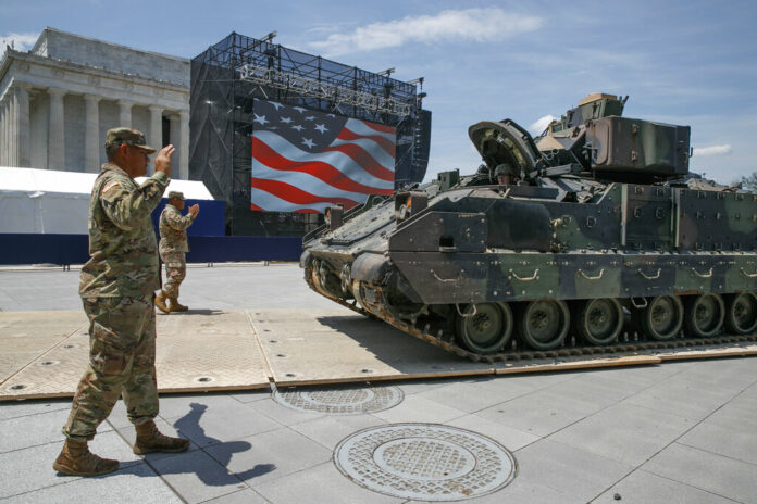 Army soldiers with the 3rd Infantry Division, 1st Battalion, 64th Armored Regiment, move a Bradley Fighting Vehicle into place by the Lincoln Memorial, Wednesday, July 3, 2019, in Washington, ahead of planned Fourth of July festivities with President Donald Trump. Photo: Jacquelyn Martin / AP Army soldiers with the 3rd Infantry Division, 1st Battalion, 64th Armored Regiment, move a Bradley Fighting Vehicle into place by the Lincoln Memorial, Wednesday, July 3, 2019, in Washington, ahead of planned Fourth of July festivities with President Donald Trump. Photo: Jacquelyn Martin / AP
