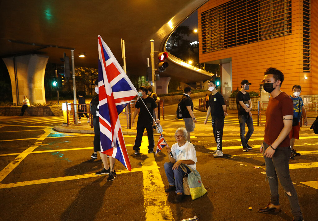 Protesters block a road after a march against government's policy on the extradition bill in Hong Kong Sunday, July 7, 2019. Protesters in Hong Kong are taking their message to visitors from mainland China on Sunday in a march to a high-speed rail station that connects to Guangdong city and other mainland destinations. Photo: Vincent Yu
