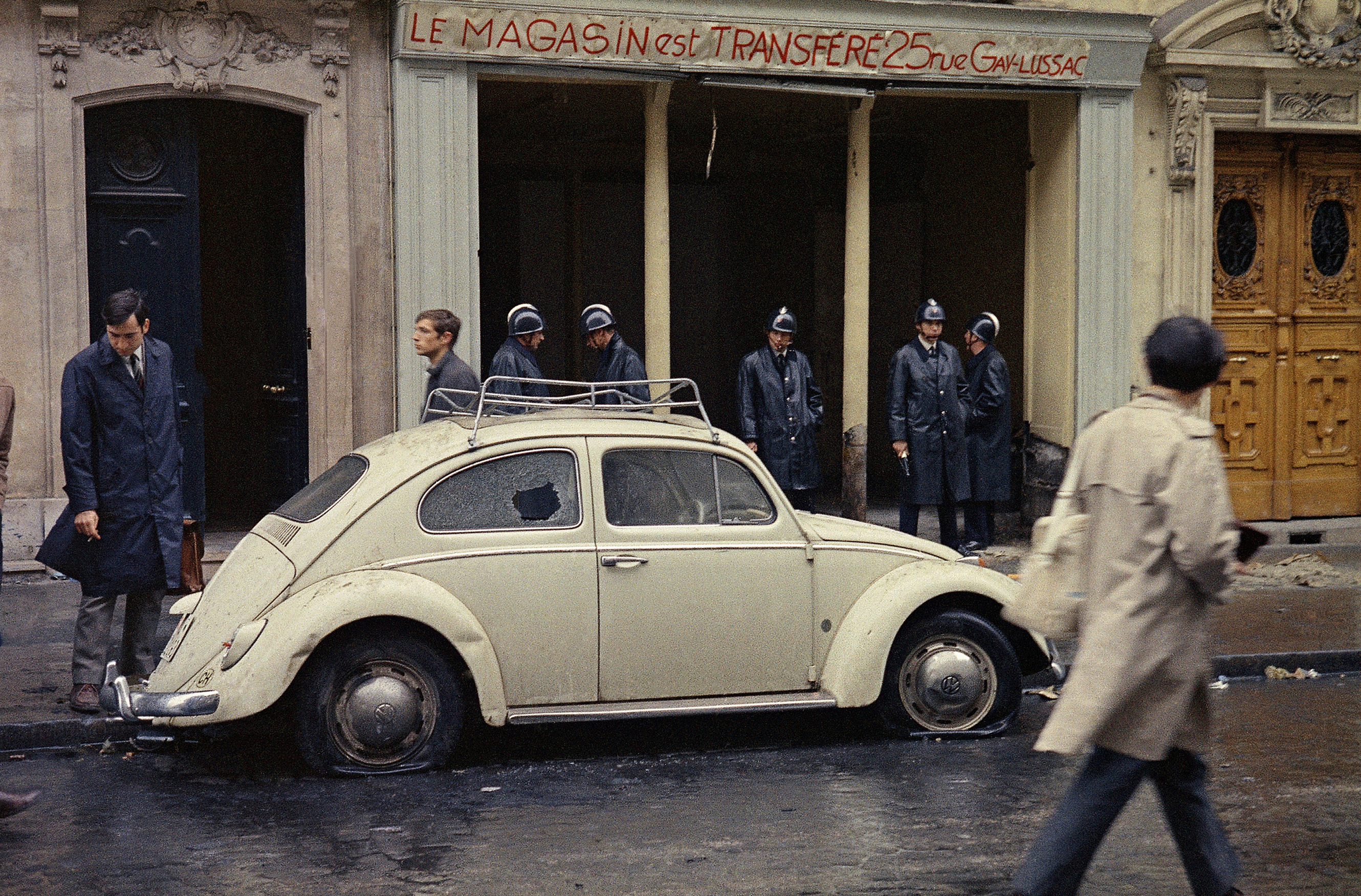 In this May 11, 1968 file photo, Guards stand in front of a shop on a street in the Latin Quarter of Paris, following a student riot and general strike that rocked the city. Photo: AP