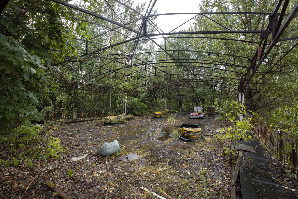 A playground is seen in the abandoned city of Prypyat some 3 kilometers (1.86 miles) from Chernobyl in Prypyat, Ukraine, Wednesday, July 10, 2019. A structure built to confine radioactive dust from the nuclear reactor at the center of the 1986 Chernobyl disaster was formally unveiled on Wednesday. Photo: Ukrainian Presidential Press Office via AP