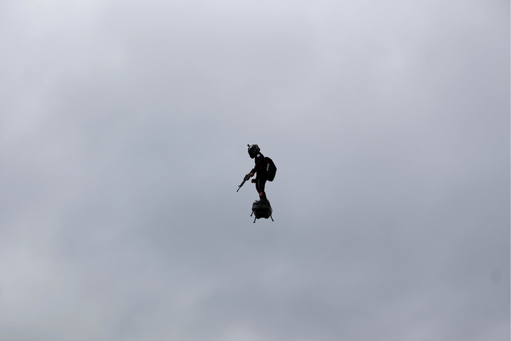 A French soldier on a hoverboard is pictured during Bastille Day parade Sunday, July 14, 2019 on the Champs Elysees avenue in Paris. Photo: Kamil Zihnioglu / AP