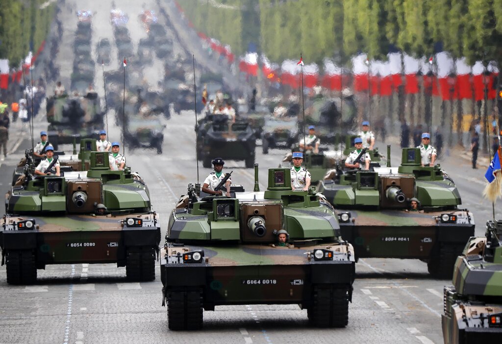 Tanks rolling on the Champs-Elysees avenue during the Bastille Day parade in Paris, France, Sunday July 14, 2019. Photo: Michel Euler / AP