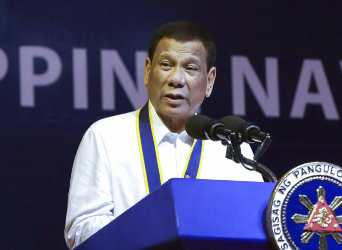FILE - In this June 17, 2019, file photo made available by the Malacanang Presidential Photo, Philippine President Rodrigo Duterte delivers his speech during the 121st Philippine Navy Anniversary at Sangley point, Cavite province, Philippines. Duterte is 