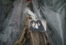 Anime Studio Hit by Deadly Fire Is Known for Skill, Fan Base A keychain with a cartoon image is placed on top of flowers placed near the Kyoto Animation Studio building destroyed in an attack Friday, July 19, 2019, in Kyoto, Japan. Photo: Jae C. Hong / AP