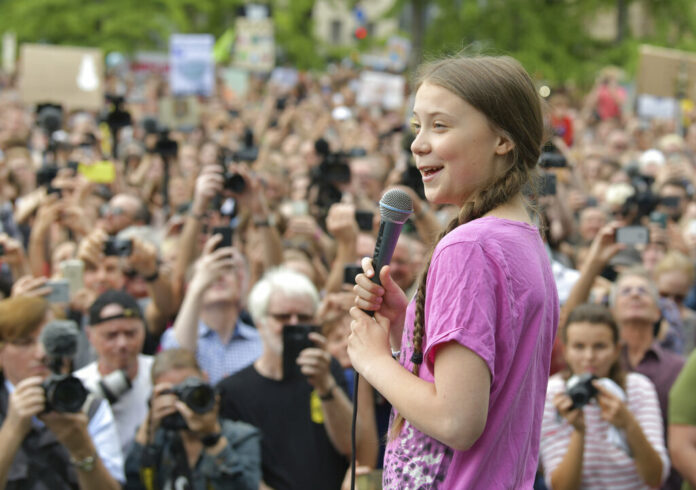 Swedish climate activist Greta Thunberg takes part in the school strike demonstration Fridays for future in Berlin, Germany, July 19, 2019. Photo: Paul Zinken / dpa via AP