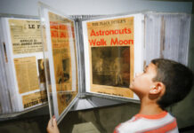 The US marks 50 years after Apollo 11’s ‘giant leap’ on moon Ethan Reynolds browses a display of archival newspaper front pages announcing the first moon landing at the Armstrong Air and Space Museum as special events are underway for visitors commemorating the milestone's 50th anniversary, Saturday, July 20, 2019, in Wapakoneta, Ohio. Photo: John Minchillo / AP