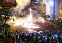 Clashes Involving Hong Kong’s Protest Movement Grow Violent Protesters are engulfed by teargas during a confrontation with riot police in Hong Kong Sunday, July 21, 2019. Hong Kong police launched tear gas at protesters Sunday after a massive pro-democracy march continued late into the evening. The action was the latest confrontation between police and demonstrators who have taken to the streets to protest an extradition bill and call for electoral reforms in the Chinese territory. Photo: Lo Kwanho / HK01 via AP