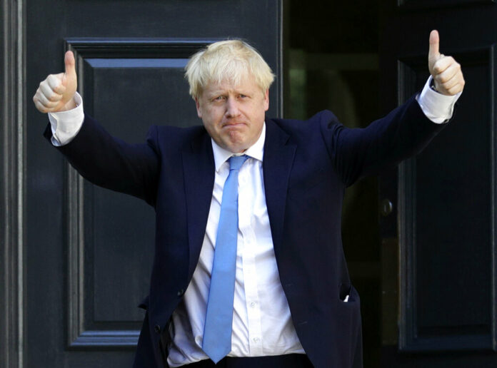 Newly elected leader of the Conservative party Boris Johnson arrives at Conservative party HQ in London, Tuesday, July 23, 2019. Brexit-hard-liner Boris Johnson, one of Britain’s most famous and divisive politicians, won the race to lead the governing Conservative Party on Tuesday, and will become the country’s next prime minister in a little over 24 hours. Photo: Aaron Chown / PA via AP