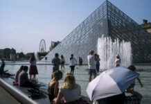 Europe Heat Wave Breaks Records, Mercury Set to Go Higher People cool off next to the fountains at Louvre Museum in Paris, France, Wednesday, July 24, 2019. Temperatures in Paris are forecast to reach 41 degrees C (86 F), on Thursday. Photo: Rafael Yaghobzadeh / AP