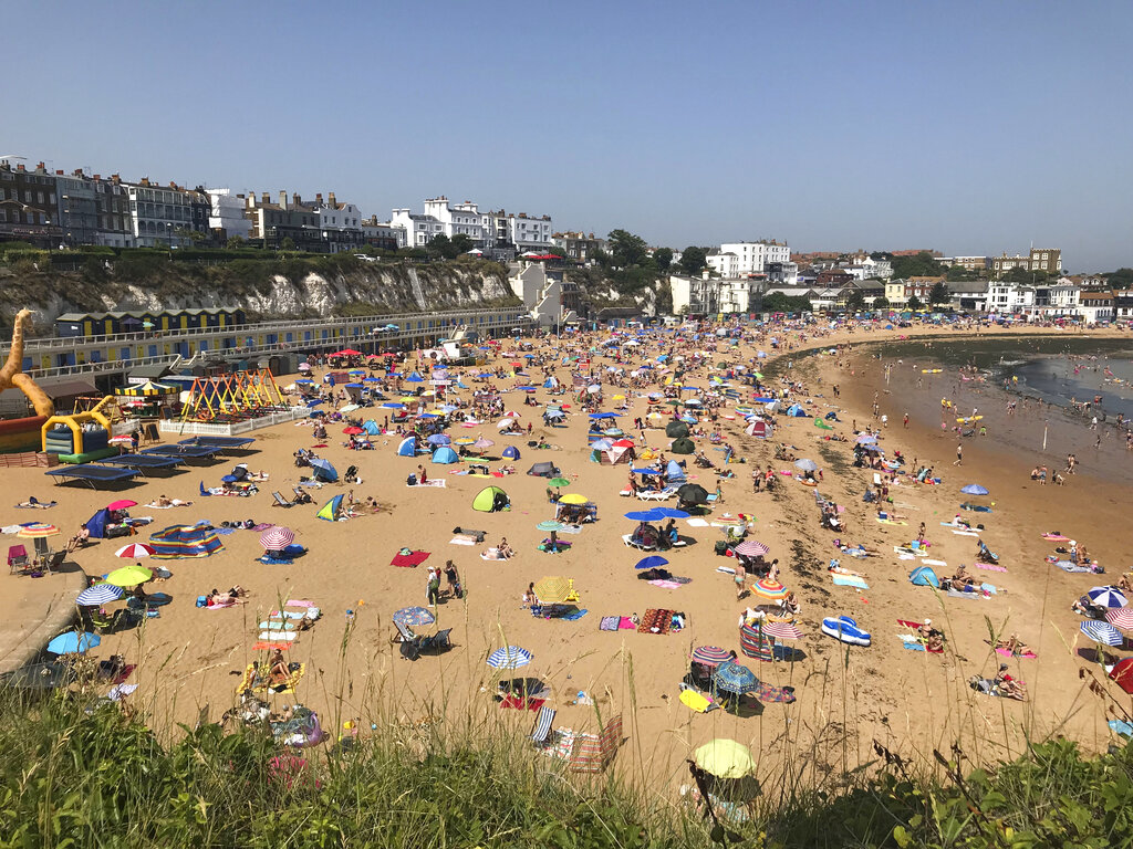 People flock to Broadstairs beach in Kent, England, Thursday July 25, 2019. Paris and London and many parts of Europe are bracing for record temperatures as the second heat wave this summer bakes the continent. The Paris area could be as hot as 42 C (108 F) Thursday as a result of hot, dry air coming from northern Africa that's trapped between cold stormy systems. Photo: Wesley Johnson / PA via AP