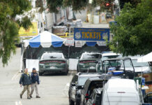Gunman Posted Online Minutes Before Killing 3 at Festival FBI personnel pass a ticket booth at the Gilroy Garlic Festival Monday, July 29, 2019 in Calif., the morning after a gunman killed at least three people, including a 6-year-old boy, and wounding about 15 others. Photo: Noah Berger / AP
