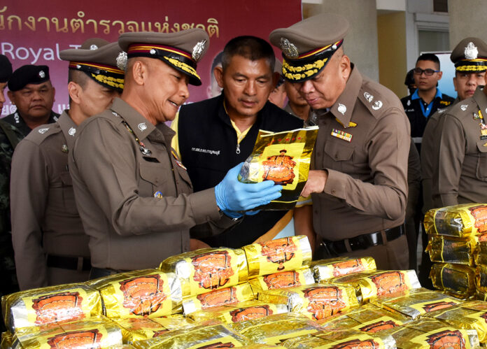 Police with a haul of 14,000 pills of yaa baa or meth and almost 400 kilograms of yaa ice seized June 24, 2019 in Nakhon Pathom.