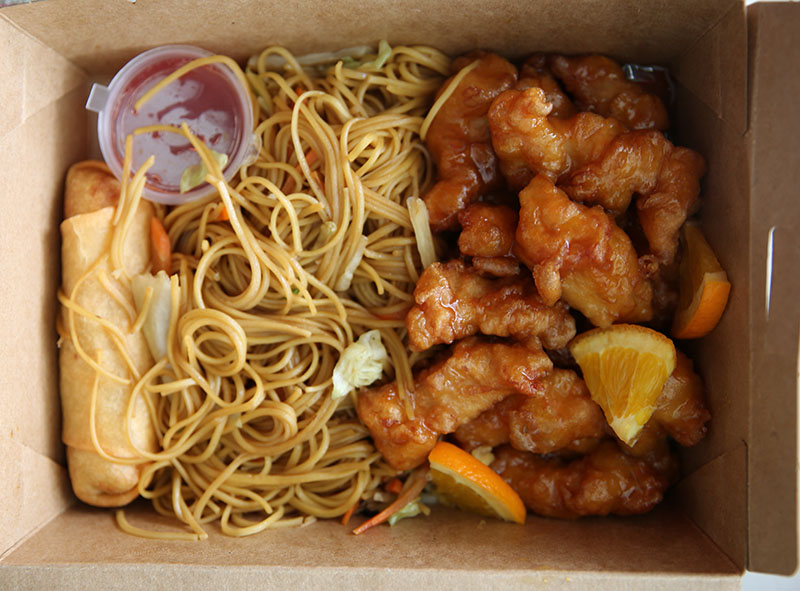 Orange Chicken and Egg Roll (240 baht with an added 30 baht for vegetable lo mein).