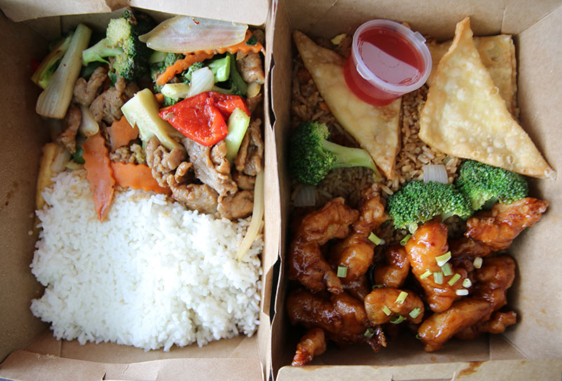 Mandarin Beef with white rice (220 baht), left.