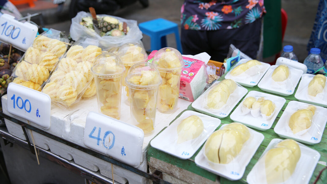 Pineapples served in plastic cups and durian wrapped in styrofoam trays in Khaosan on July 2.